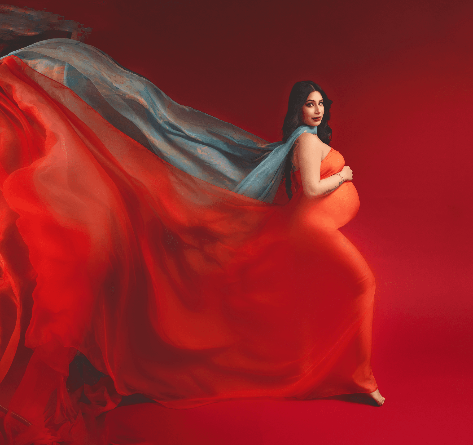 Beautiful maternity photograph of a woman in a flowing gown in Cranbourne East